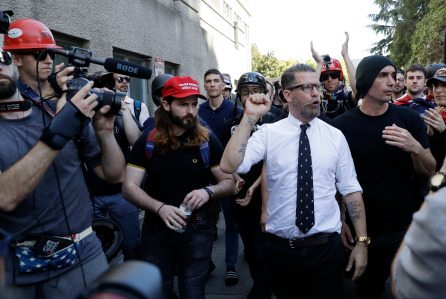 Mandatory Credit: Photo by AP/REX/Shutterstock (8721141v) Gavin McInnes is surrounded by supporters after speaking at a rally, in Berkeley, Calif. McInnes, co-founder of Vice Media and founder of the pro-Trump 