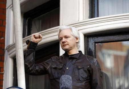 FILE - In this Friday, May 19, 2017 file photo, Julian Assange greets supporters outside the Ecuadorian embassy in London. London police say they've arrested WikiLeaks founder Julian Assange at the Ecuadorian embassy, it was reported on Thursday, April 11, 2019. (AP Photo/Frank Augstein, File)